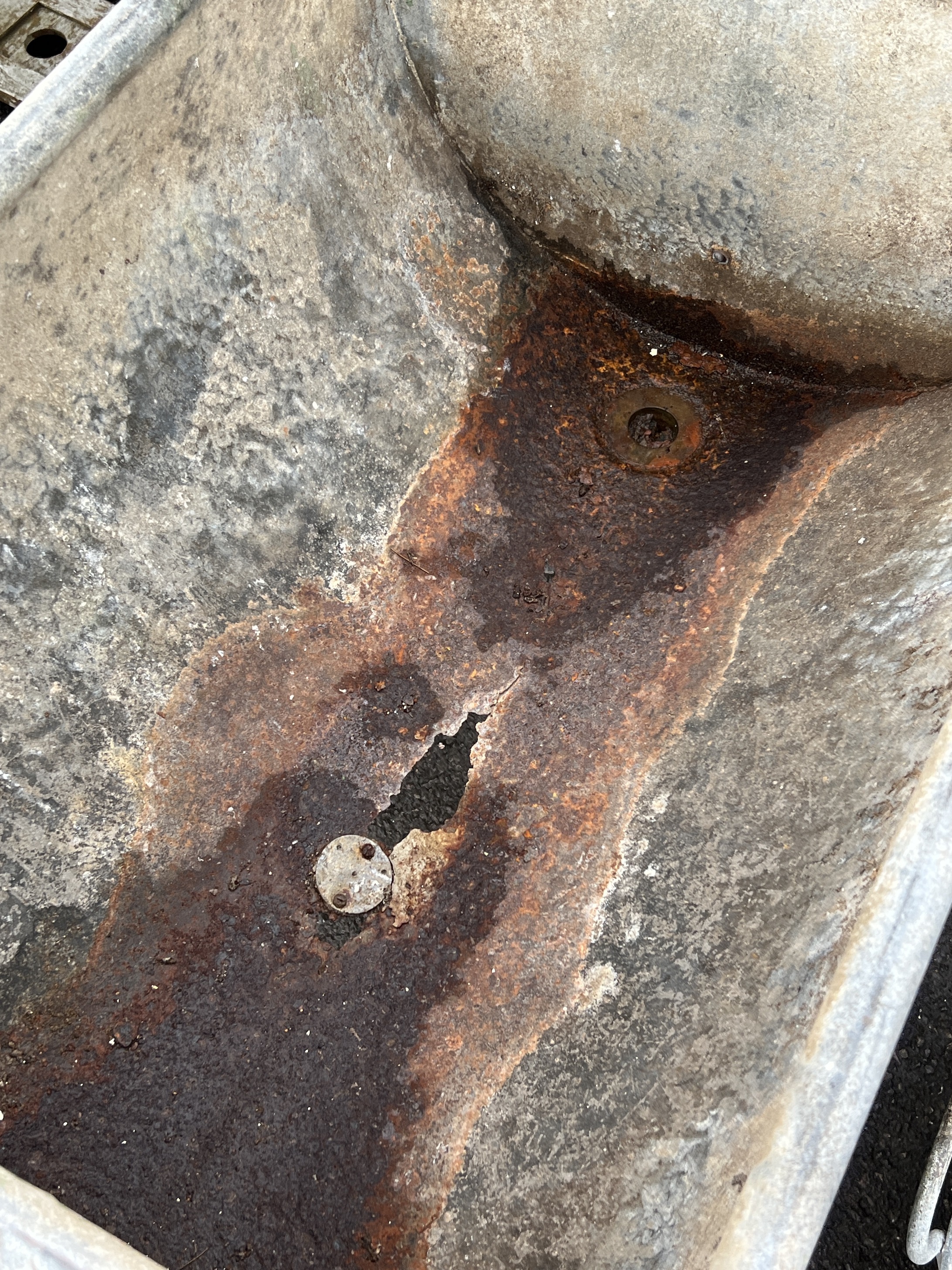 A vintage rectangular galvanised water trough, length 80cm, depth 56cm, height 82cm